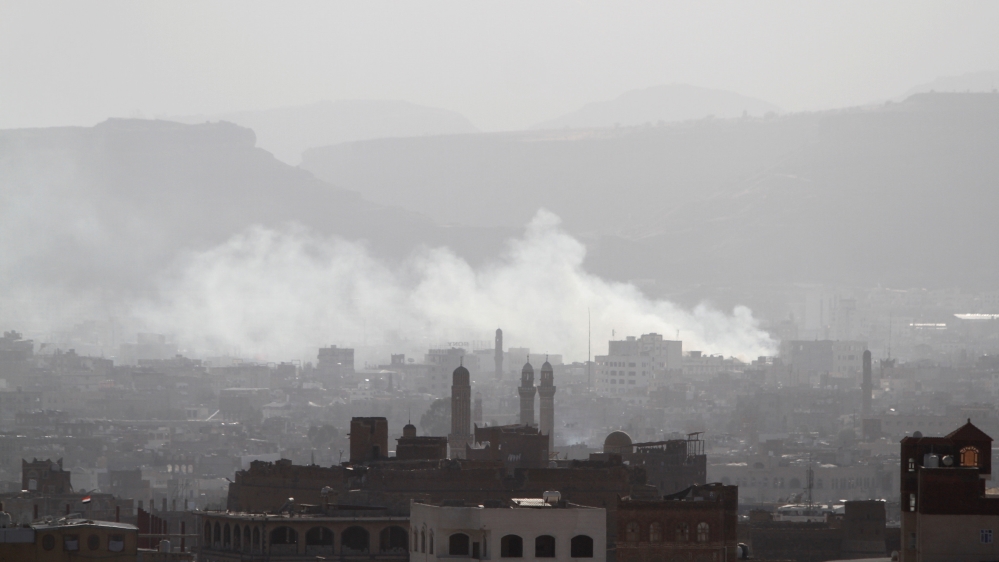Smoke rising from areas in Sanaa where Houthi fighters clashed with forces loyal to Saleh [Mohamed al-Sayaghi/Reuters]