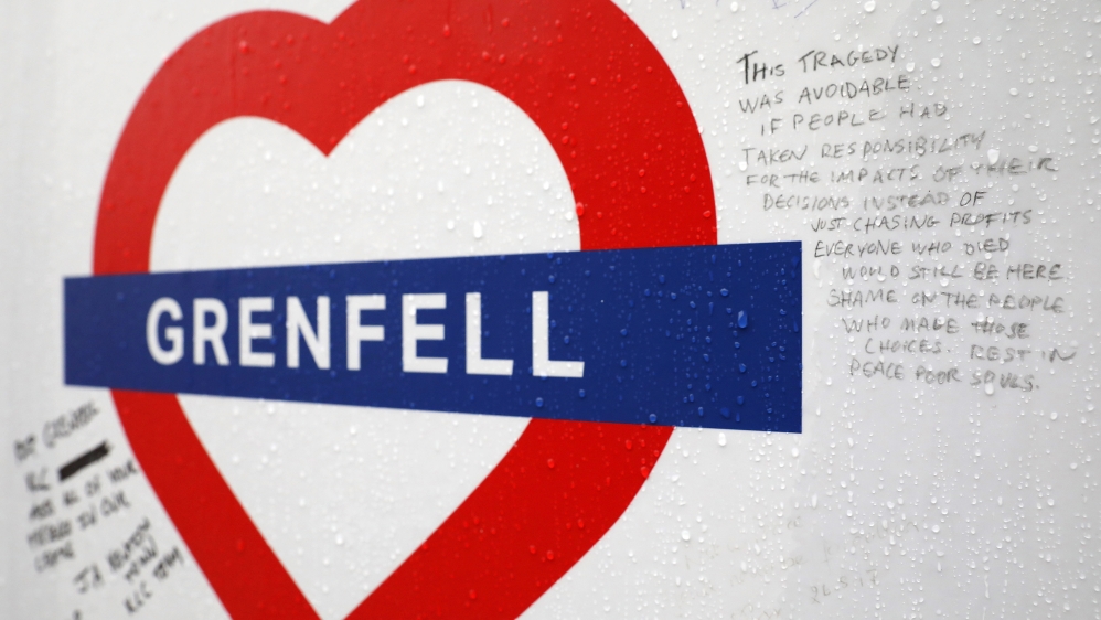Tributes still hang near Grenfell Tower, which is in west London [Dan Kitwood/Getty Images]