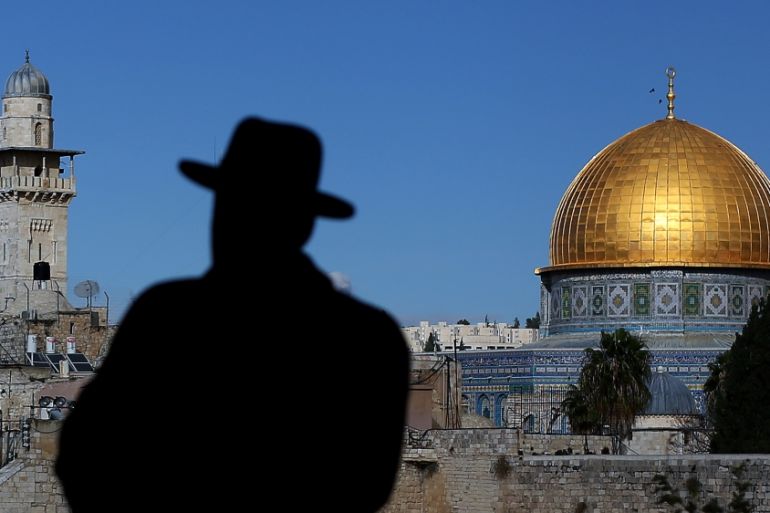 Jerusalem, Israel - November 16: An ultra-Orthodox Jew with his hat in front of the Al-Aqsa mosque the Old City of Jerusalem in Israel, on November 16, 2014 in Jerusalem, Israel. (Photo by Ronny Har