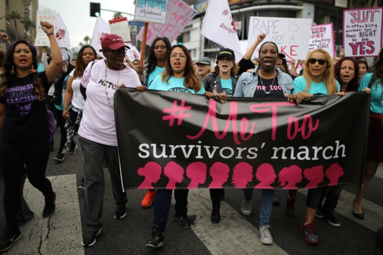 People participate in a protest march for survivors of sexual assault and their supporters in Hollywood