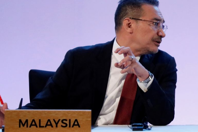 Malaysia''s Defence Minister Hishammudin talks with Philippine Defence Secretary Lorenzana during the ASEAN Defense Ministers'' Meeting in Pampanga