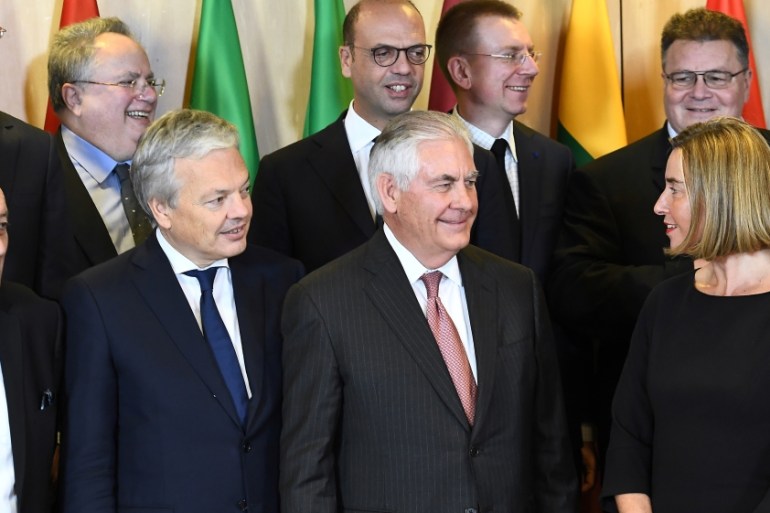 U.S. Secretary of State Rex Tillerson and European Union foreign policy chief Federica Mogherini pose for a group photo with EU foreign ministers in Brussels