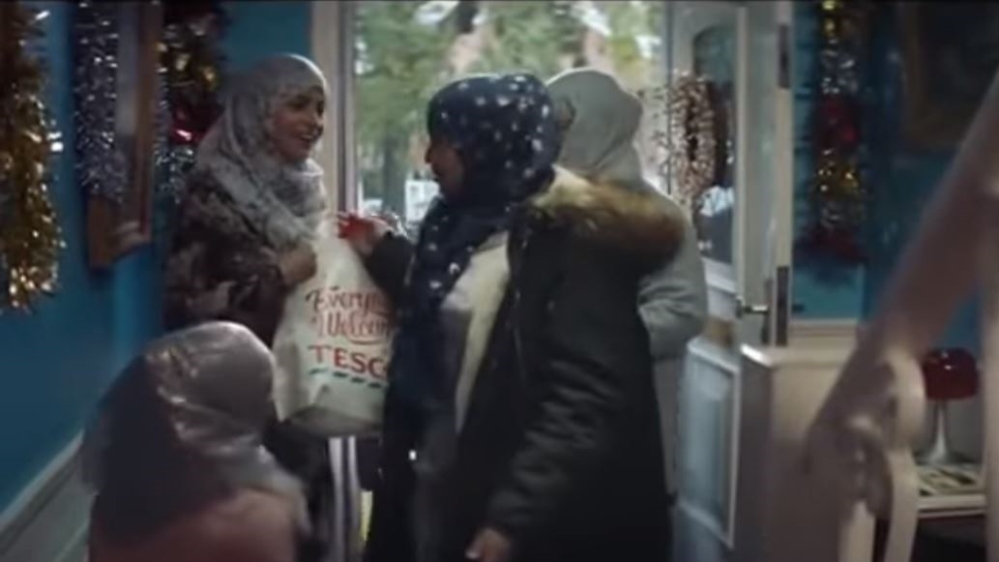 Critics said Tesco should not have featured Muslims in its Christmas advertising campaign because the holiday is a Christian celebration [Screenshot from Tesco's advert]