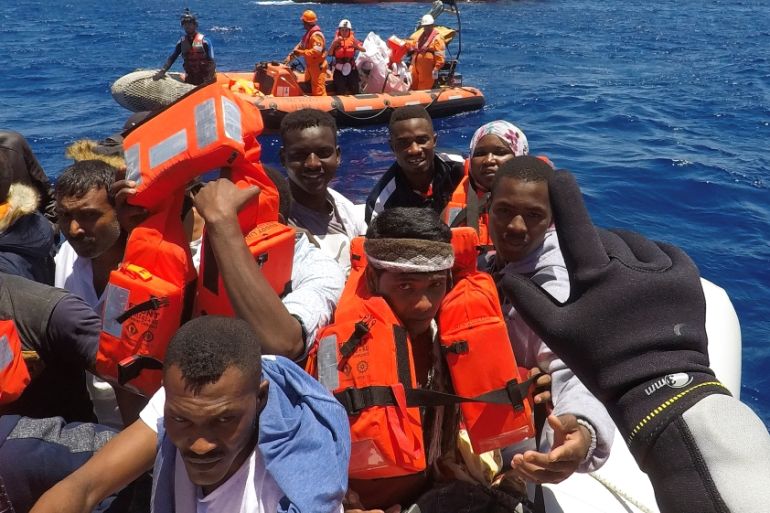 Migrants on a dinghy are rescued by "Save the Children" NGO crew from the ship Vos Hestia in the Mediterranean sea off Libya coast