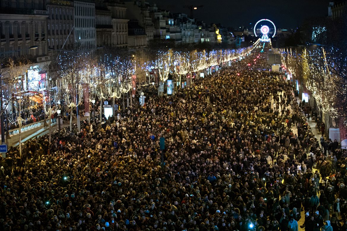 General view of the Champs Elysees Avenue in Paris as revellers take part in New Year celebrations, early January 1, 2018. [Philippe Wojazer/Reuters]