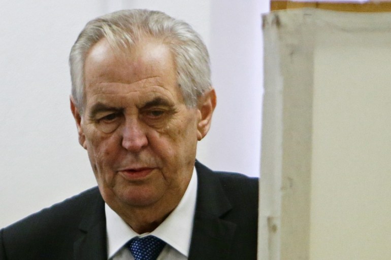 Incumbent president Milos Zeman arrives to vote at a polling station during the second round of the presidential election in Prague
