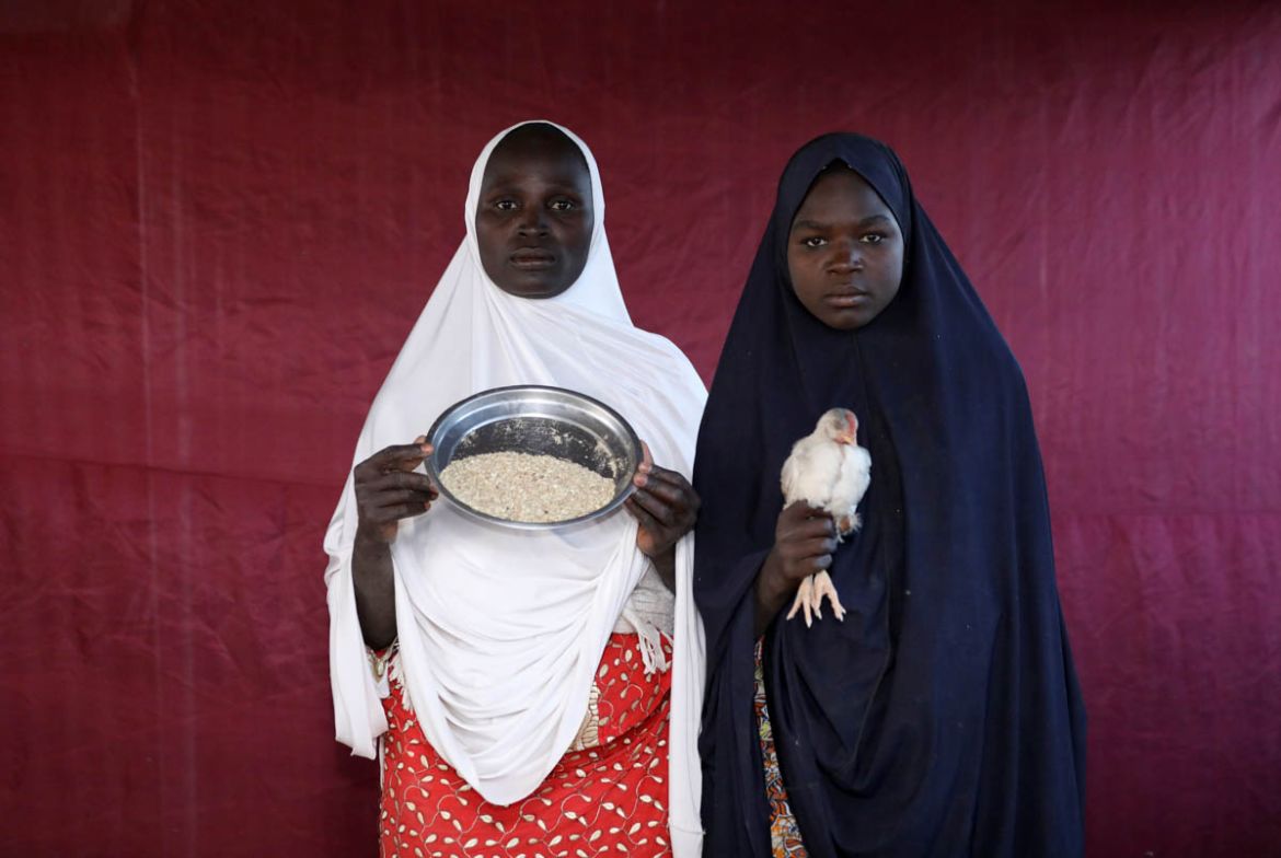 Binta Lawal holds up a bowl of poultry feed with Aisha Buba. While many would prefer money, cash distribution in Nigeria''s northeast is fraught with risk. Reports of corruption in the humanitarian cri