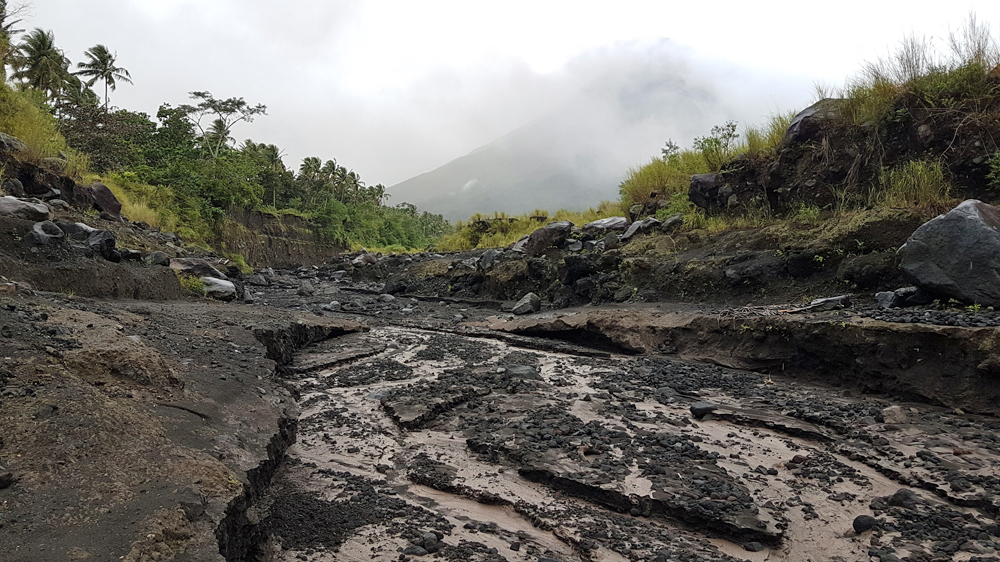 This gorge in Anoling village was formed by volcanic material that flowed from Mt Mayon [JC Gotinga/Al Jazeera]