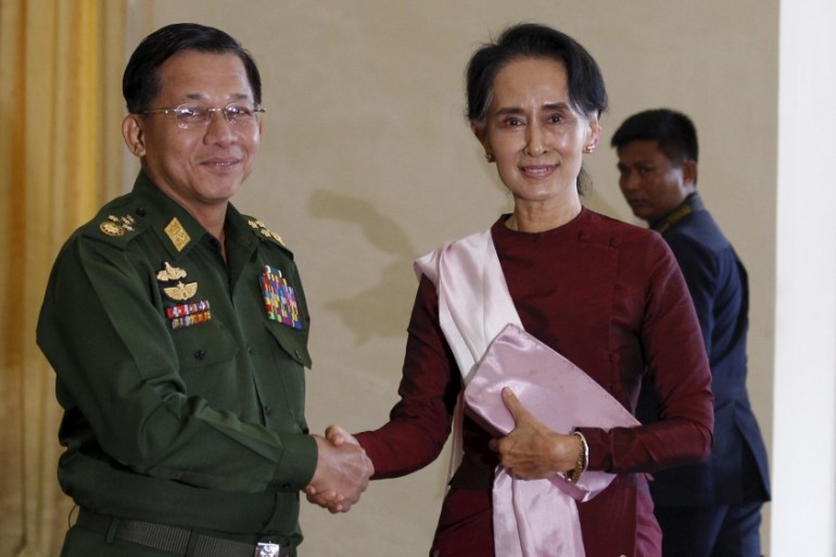 Senior General Min Aung Hlaing, Myanmar''s commander-in-chief, shakes hands with National League for Democracy (NLD) party leader Aung San Suu Kyi before their meeting in Hlaing''s office at Naypyitaw