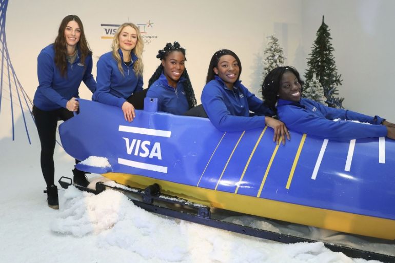 Team Visa athletes and members of the Nigerian Women''s Bobsled Team give Hilary Knight and Maggie Voisin a lesson on bobsledding at an Olympic Winter Games innovation and commerce event on December 7,