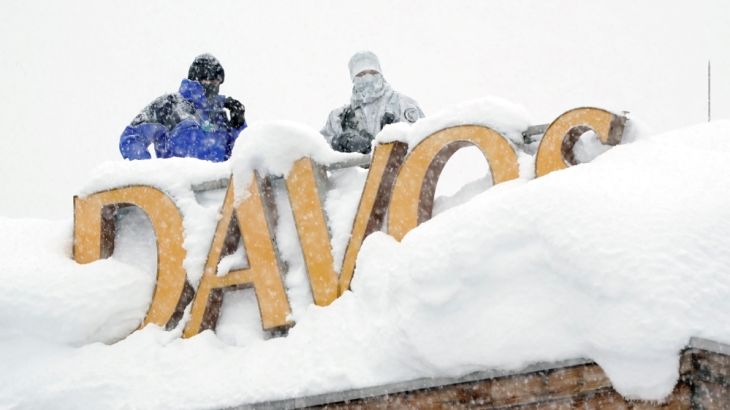 Snipers hold their position on the roof of a hotel during the WEF annual meeting in Davos