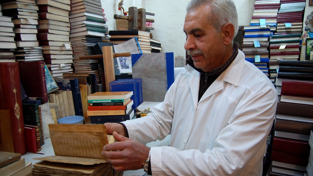 Ben Sassi has been binding and restoring books since 1974 [Jillian Kestler-D'Amours/Al Jazeera]