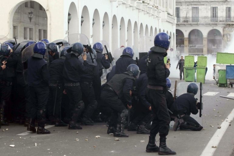 Demonstrators clash with police after Friday prayers in Algiers
