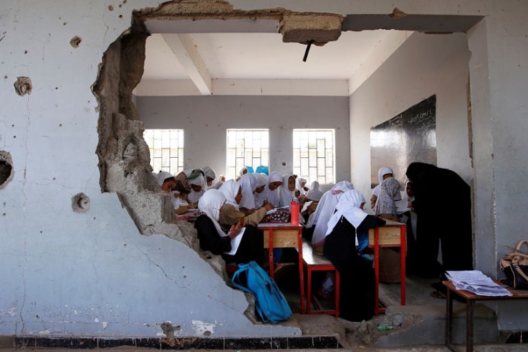 Girls attend a class at their school, damaged by a recent Saudi-led air strike, in the Red Sea port city of Hodeidah
