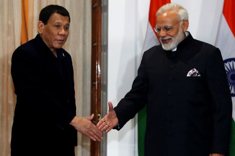 Philippine President Rodrigo Duterte shakes hands with Indian Prime Minister Narendra Modi during a photo opportunity ahead of their meeting at Hyderabad House in New Delhi