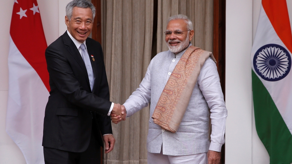 Singapore Prime Minister Lee Hsien Loong emphasised the need to 'redouble efforts to promote trade and investment' [Adnan Abidi/Reuters]