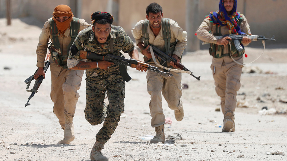 The SDF and YPG played a prominent role in the defeat of ISIL [File: Goran Tomasevic/Reuters]