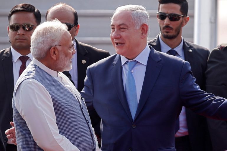 Israeli Prime Minister Benjamin Netanyahu is welcomed by his Indian counterpart Narendra Modi upon his arrival at Air Force Station Palam in New Delhi