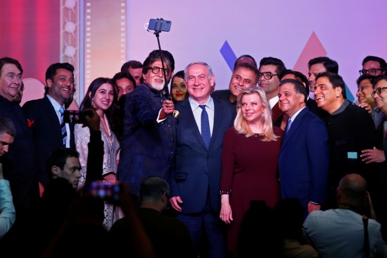 Bollywood actor Amitabh Bachchan takes a photo with Israeli Prime Minister Benjamin Netanyahu, his wife Sara and other Bollywood personalities during "Shalom Bollywood" event in Mumbai