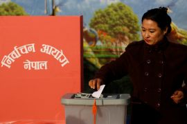 A woman casts her vote during the parliamentary and provincial elections in Bhaktapur