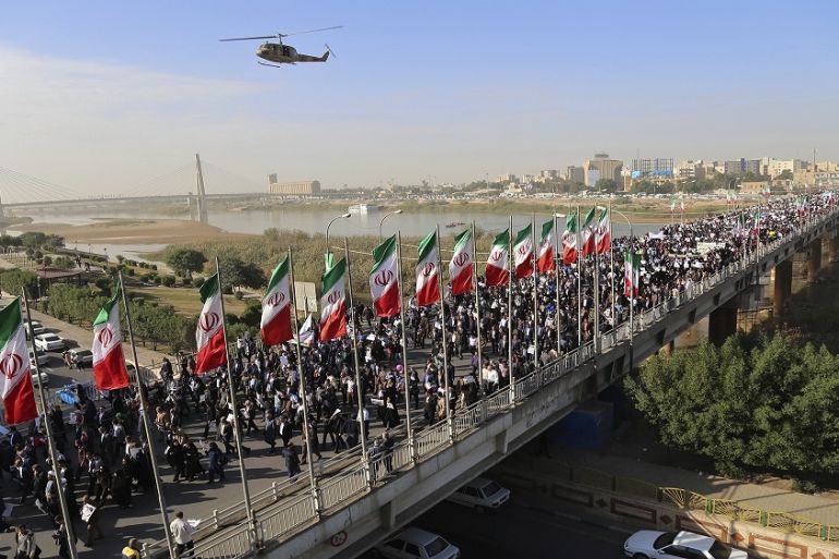 In this photo provided by Mehr News Agency, demonstrators attend a pro-government rally in the southwestern city of Ahvaz, Iran, Wednesday, Jan. 3, 2018.