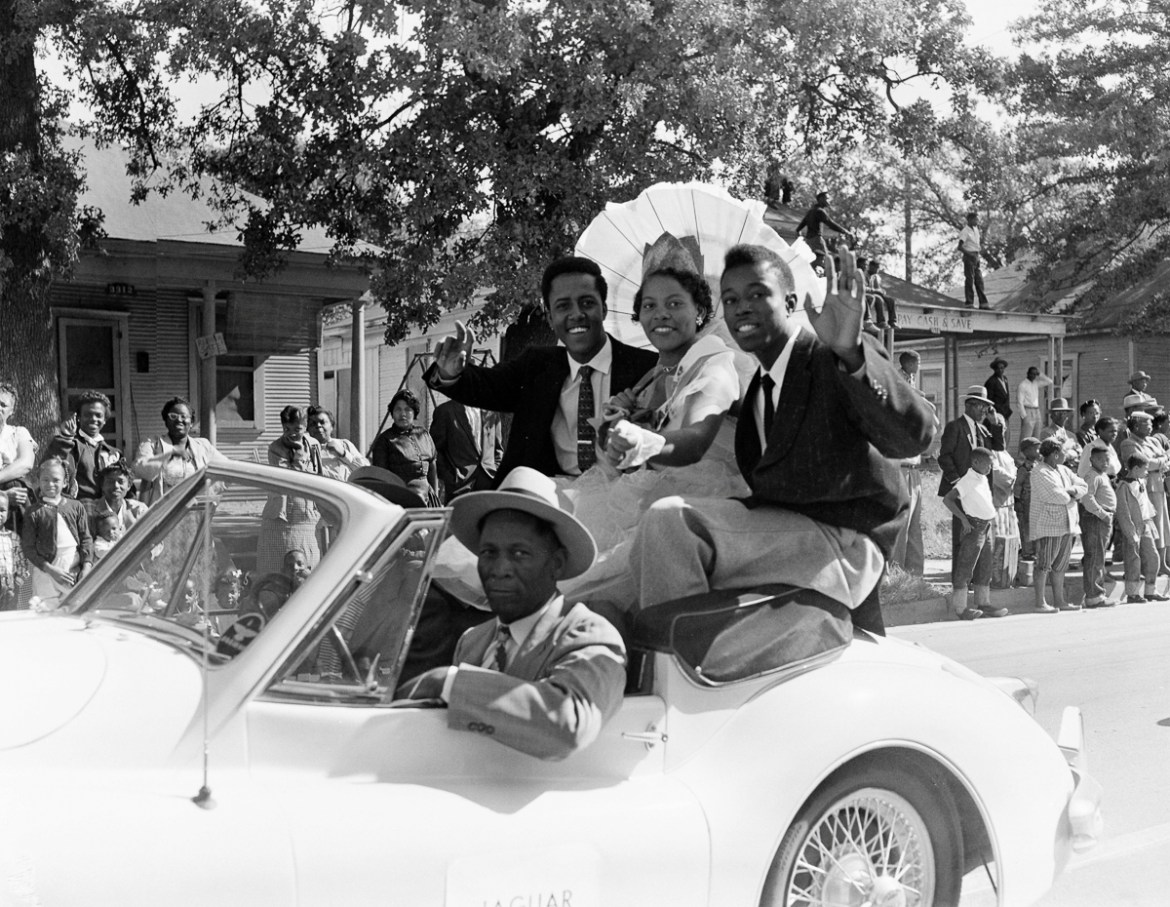 11: A carful of passengers enjoying the crowds lining the parade route during the Texas State Fair in Dallas on 17 October 1955. Photojournalism presentations of the civil rights era—as with all photo