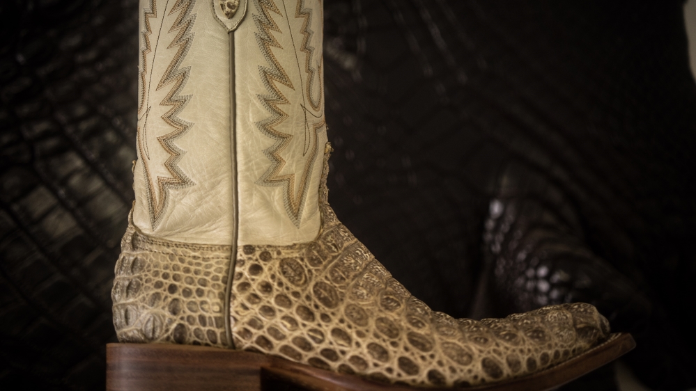 Handmade crocodile boots can sell for more than $1,500 a pair [Al Jazeera]