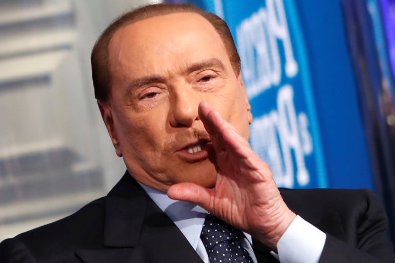 Italy''s former Prime Minister Berlusconi gestures during the taping of the television talk show "Porta a Porta" (Door to Door) in Rome