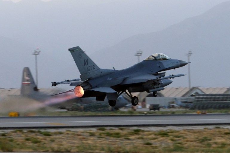 A U.S. Air Force F-16 Fighting Falcon aircraft takes off for a nighttime mission at Bagram Airfield