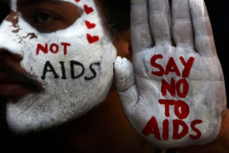 A student displays his face and hand painted with messages during an HIV/AIDS awareness campaign on the occasion of World AIDS Day in Chandigarh, India, December 1, 2017. REUTERS/Ajay Verma TPX IMAGES