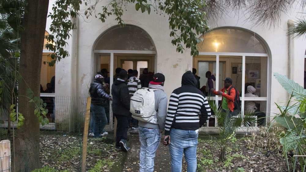 Migrants and refugees wait to be seen by the helpdesk [Ylenia Gostoli/Al Jazeera]