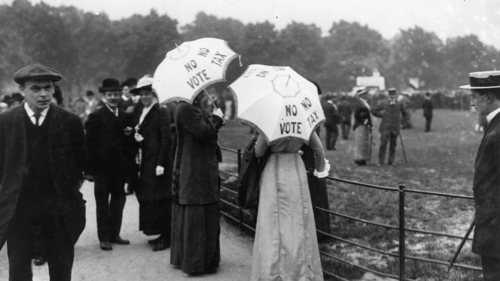 Suffragettes help the cause by carrying umbrellas with the slogan 'No Vote, no Tax' in London's Hyde Park [Hulton Archive/Getty Images]
