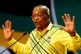ILE PHOTO: President of South Africa Jacob Zuma gestures to his supporters at the 54th National Conference of the ruling ANC at the Nasrec Expo Centre in Johannesburg