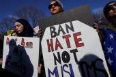 Activists rally in front of the White House, to mark the anniversary of 'the first Muslim and refugee ban' and subsequent bans, in Washington, US, January 27, 2018 [Yuri Gripas/Reuters]
