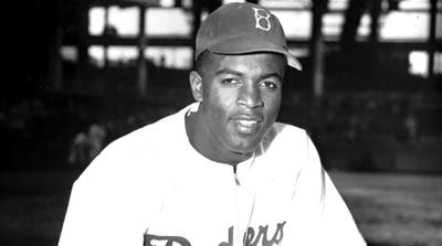 Robinson helped the Dodgers win the World Series in 1955 [John Rooney/AP Photo] 