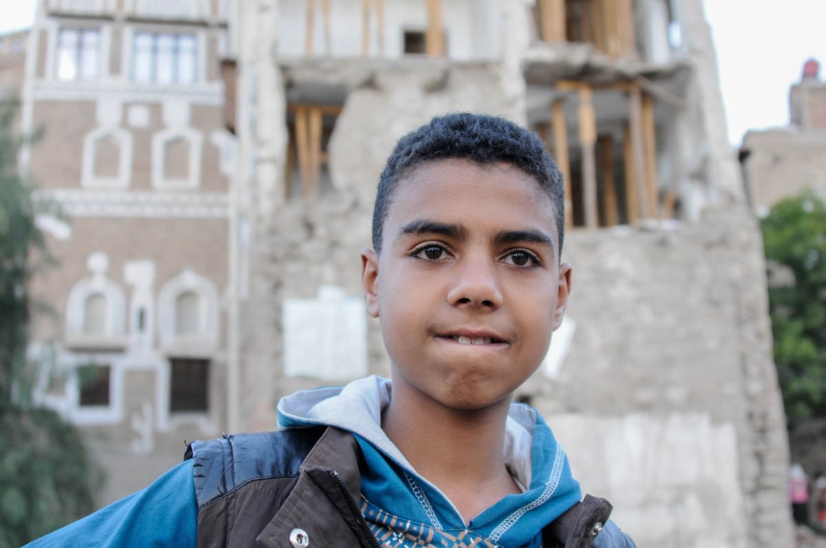 13 year old Ali Abdulkader stands at the site of what was once his former home in the Old City of Sana’a. Ali lost four members of his family; his father, brother, uncle and aunt, when their house was