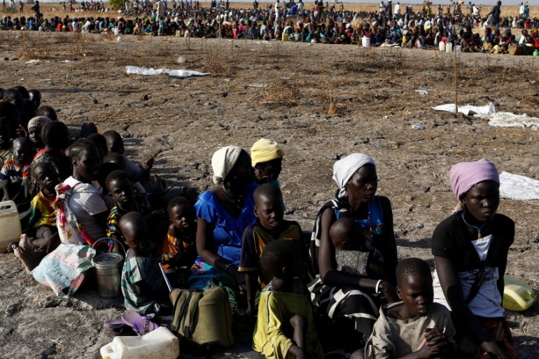 Women and children wait to be registered prior to a food distribution carried out by the United Nations World Food Programme (WFP) in Thonyor, Leer state