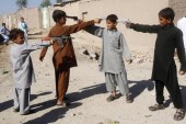 Afghan boys play with toy guns on the first day of Eid al-Adha in Jalalabad, Afghanistan [Parwiz/Reuters]