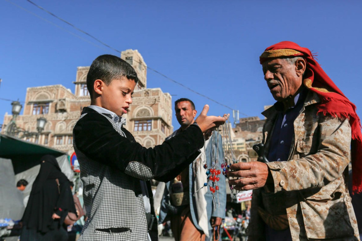 Helping support his family cope through displacement, 13 year old Jamal Mahmood juggles school and work, selling necklaces in the morning at Sana’a’s Old City market before attending school at noon. F
