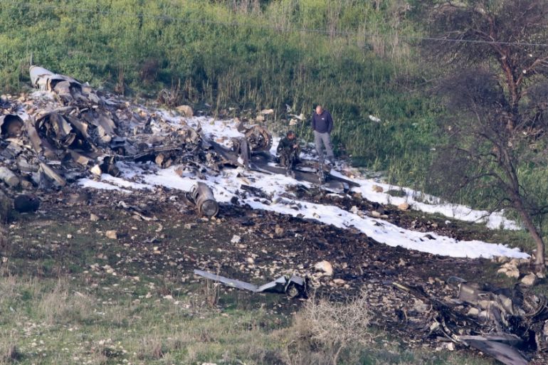 The remains of an F-16 Israeli war plane are seen near the Israeli village of Harduf