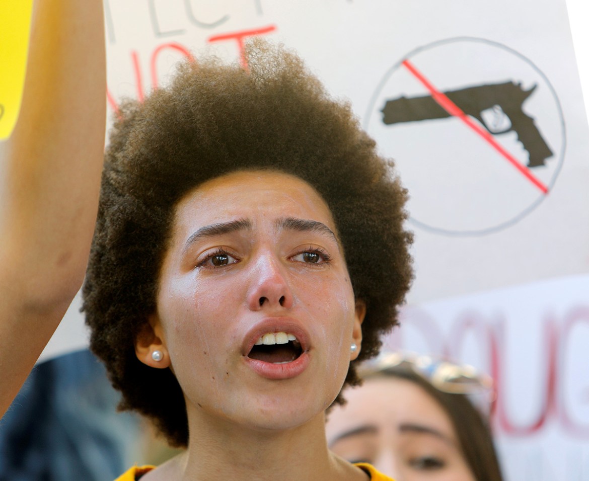 A protester weeps while chanting at a rally calling for more gun control three days after the shooting at Marjory Stoneman Douglas High School, in Fort Lauderdale, Florida, U.S., February 17, 2018. RE