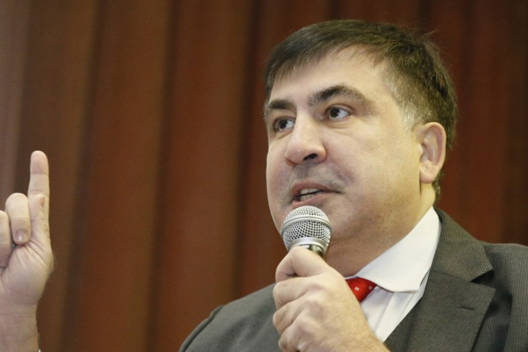 Ukrainian opposition figure and Georgian former President Mikheil Saakashvili delivers a speech as he attends a court hearing in Kiev