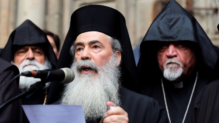 Greek Orthodox Patriarch of Jerusalem, Theophilos III, speaks during a news conference with other church leaders in front of the closed doors of the Church