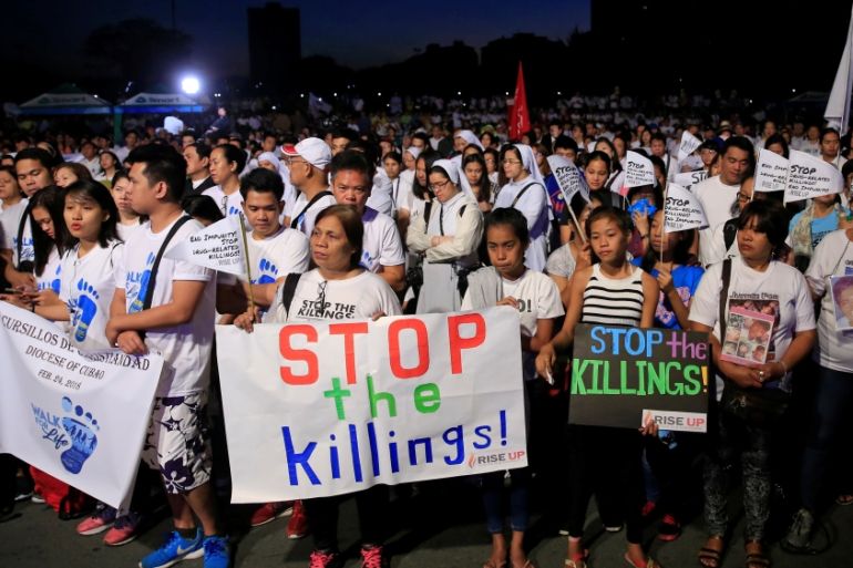 Participants display placards during "Walk for Life" in Luneta park, Metro Manila
