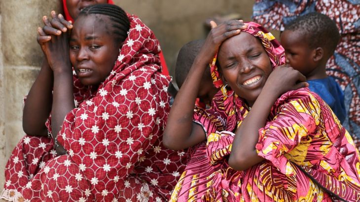 Relatives of missing school girls react in Dapchi in the northeastern state of Yobe