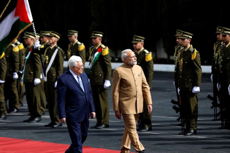 Palestinian President Mahmoud Abbas reviews the honour guard with India''s Prime Minister Narendra Modi in Ramallah, in the occupied West Bank