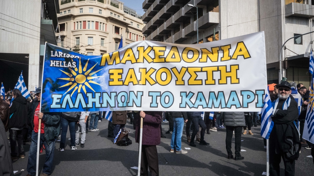 Demonstrators hold a banner describing Macedonia as 'the pride of Greece' [Patrick Strickland/Al Jazeera]