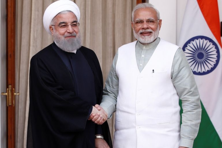 Iranian President Hassan Rouhani shakes hands with India''s Prime Minister Narendra Modi (R) during a photo opportunity ahead of their meeting at Hyderabad House in New Delhi