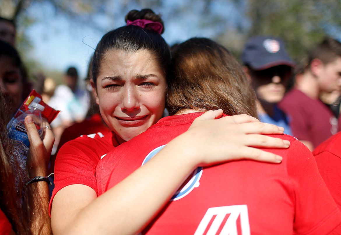A student mourns the loss of her friend during a community vigil at Pine Trails Park, in Parkland, Florida, for the victims of the shooting at Marjory Stoneman Douglas High School. Nikolas Cruz, a for