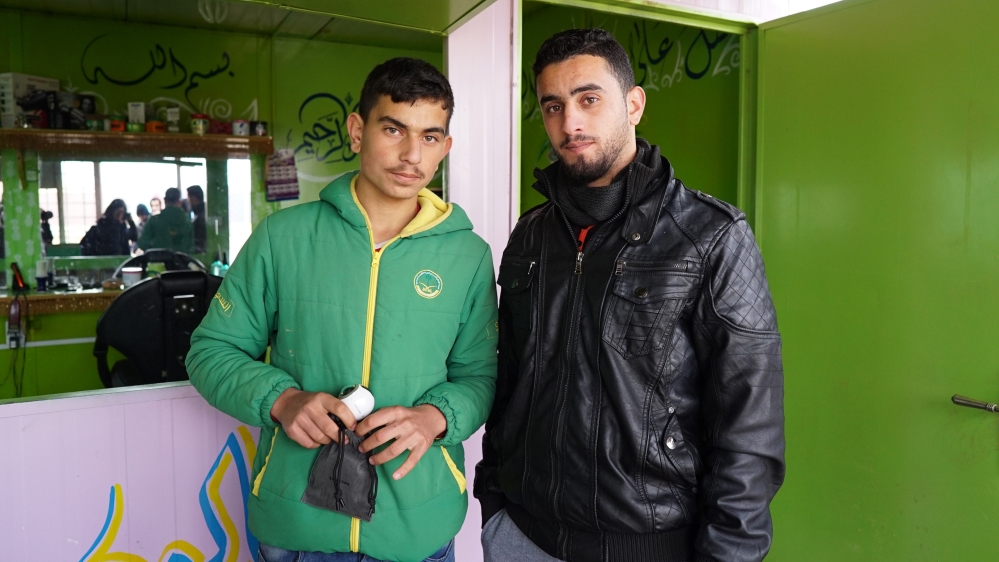 Yousef (left), 16, with his older brother, Ali, who became a barber in the camp [Joi Lee/Contrast VR]